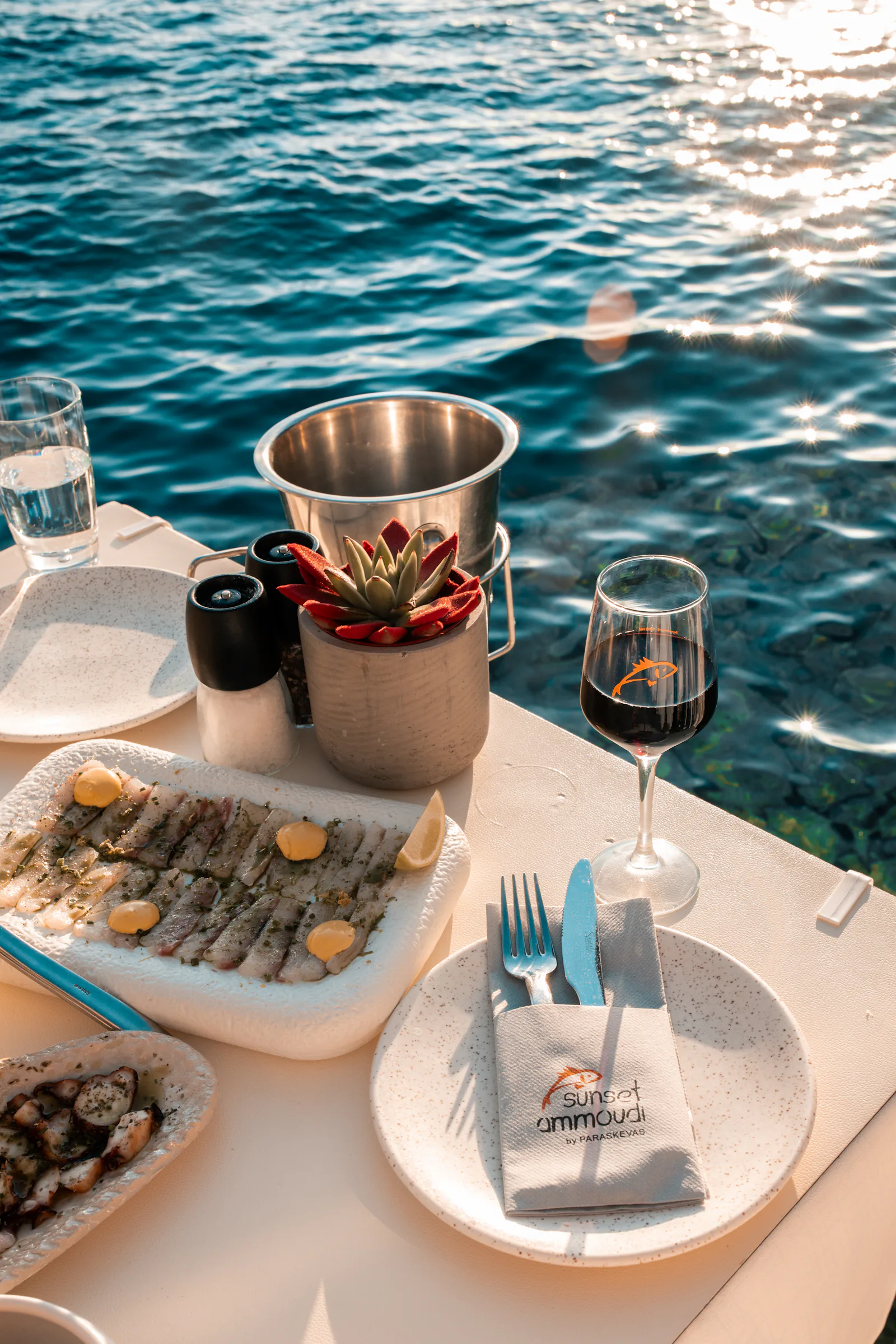 Seafood lunch and wine served on deck by the sea
