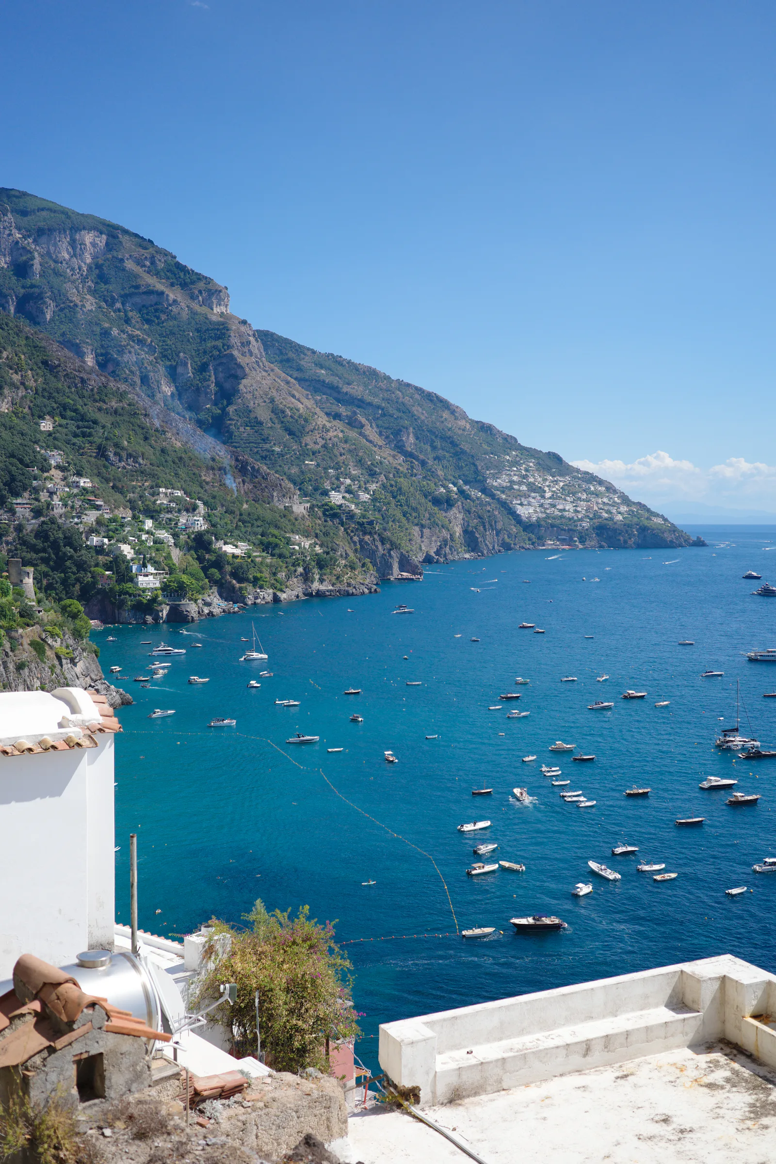 Boats anchored in the blue waters off Positano