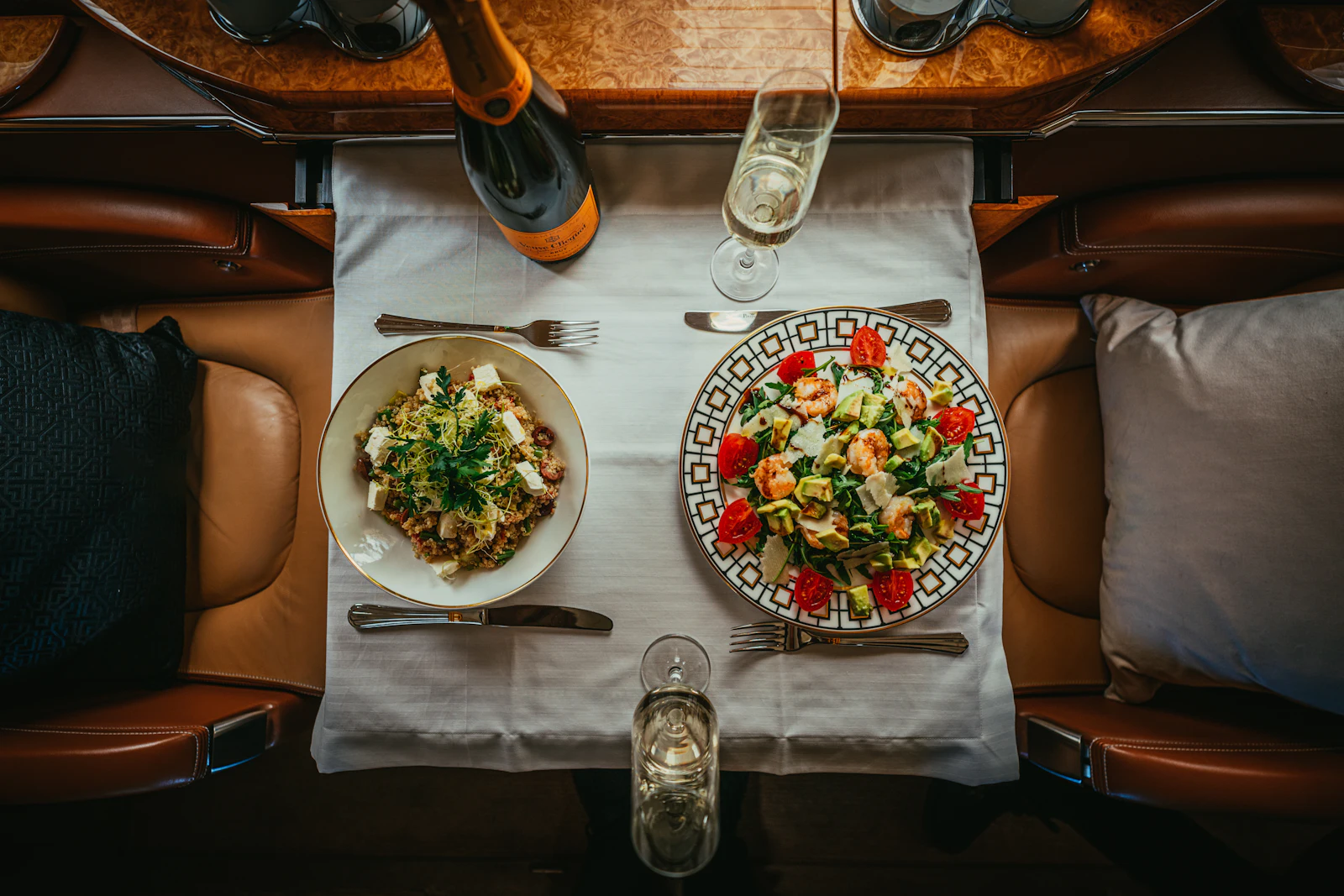 Plates of fresh food on a table on board