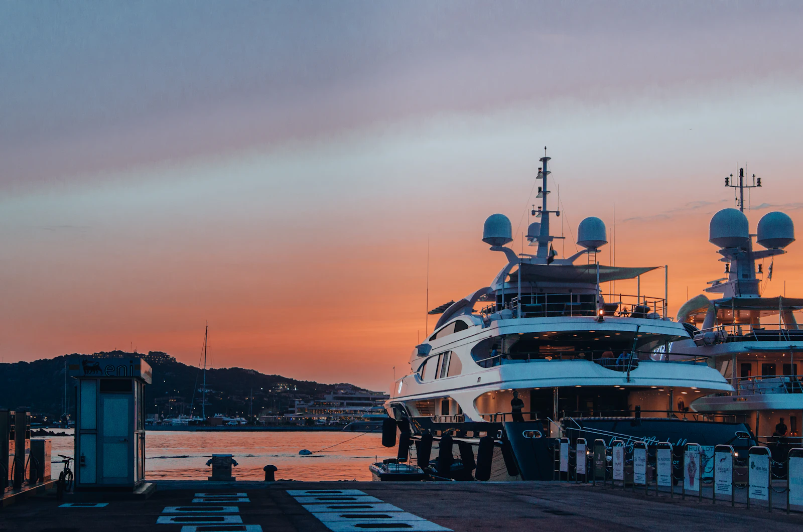 A superyacht moored at sunset